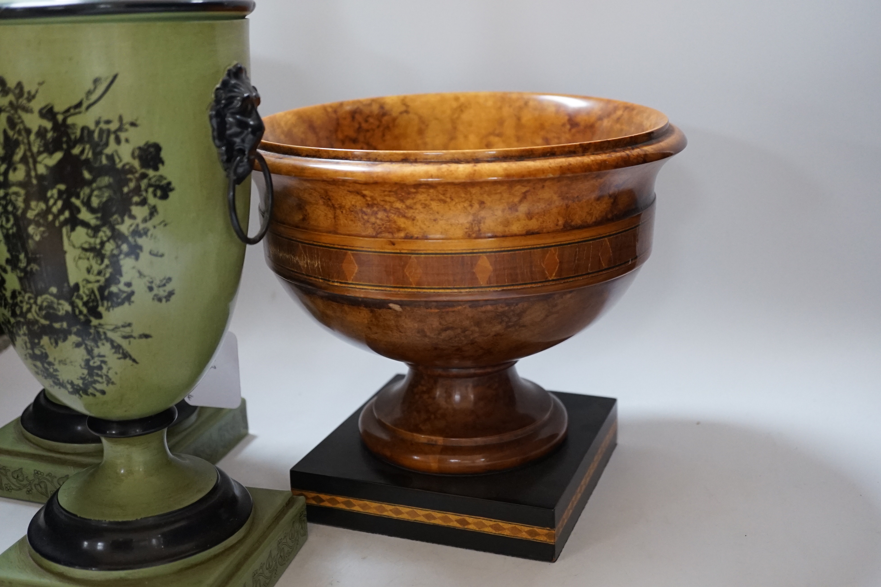 A pair of Toleware urns, a turned maple pedestal bowl and urn